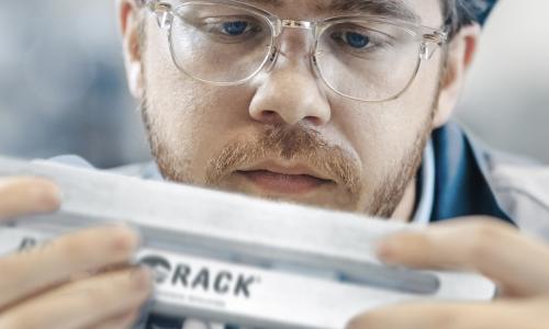 Inspector carefully examines the sanitary design of rocket rack post mount